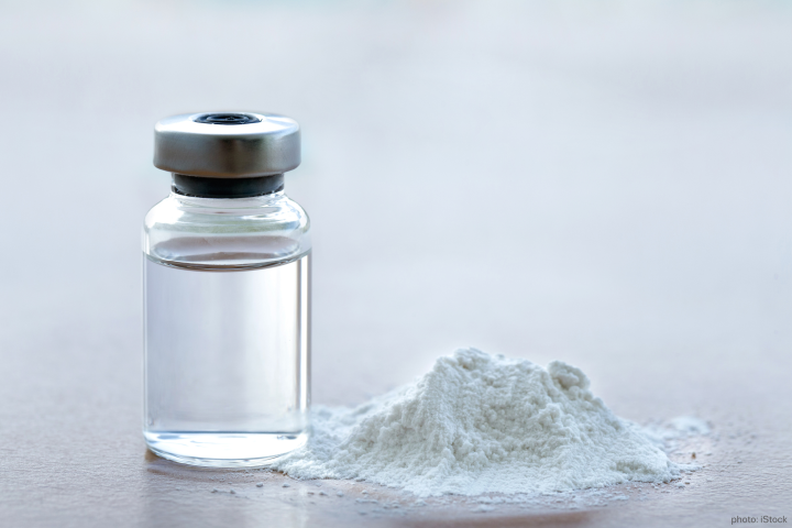 White powder and vial with a liquid